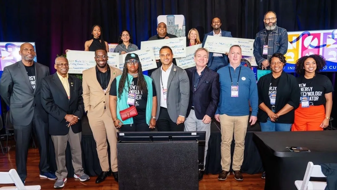 OHUB startup investment challenge winners and program leaders holding award checks