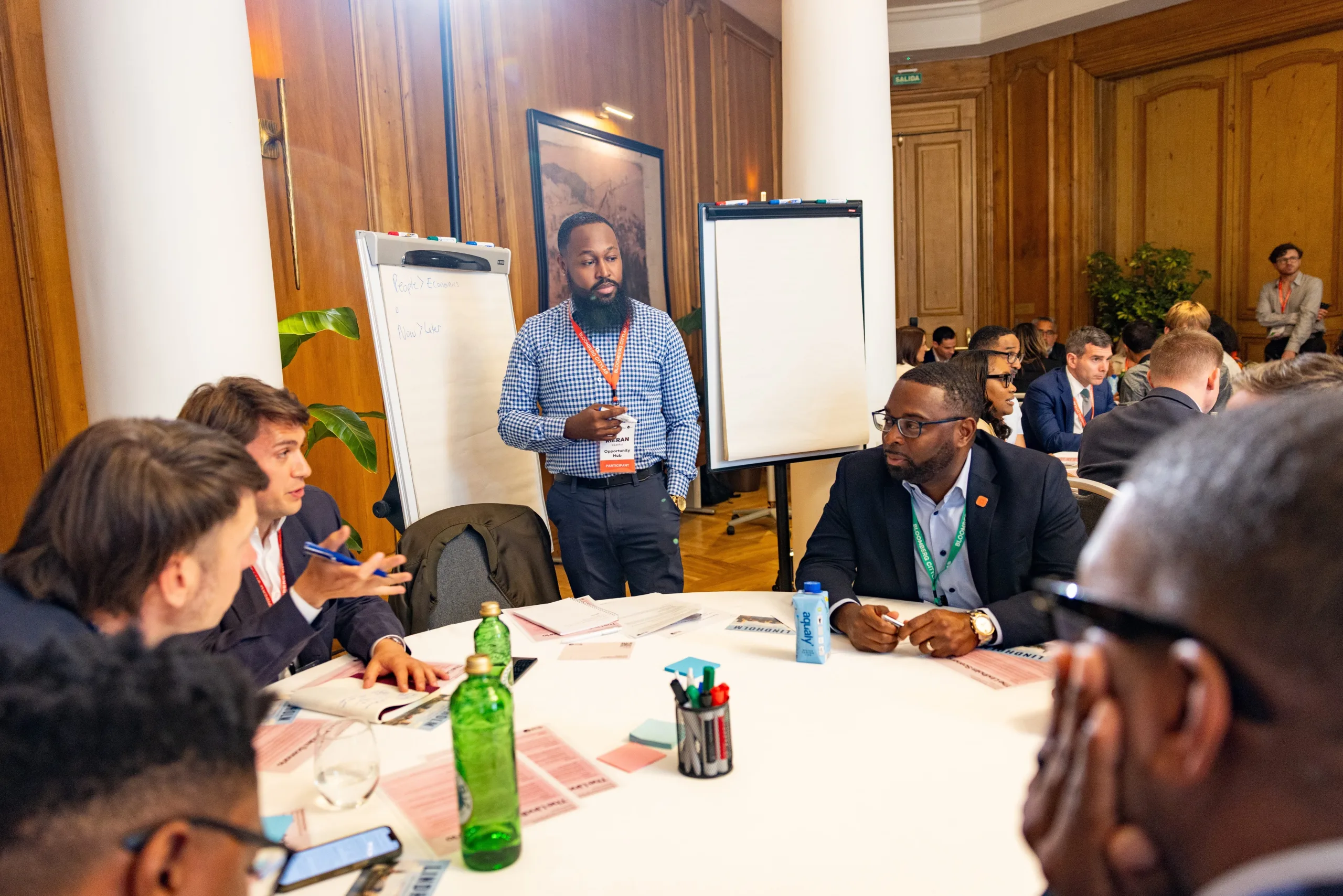 Kieran Blanks, OHUB Chief Product Officer and Aspen Fellow, facilitating a discussion with city leaders at Bloomberg CityLab 2026 in Madrid.